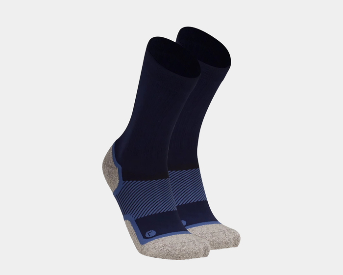 OS1st Wellness Performance Crew Socks in navy blue with gray cushioned toe and heel, ribbed upper and striped arch support, angled view.