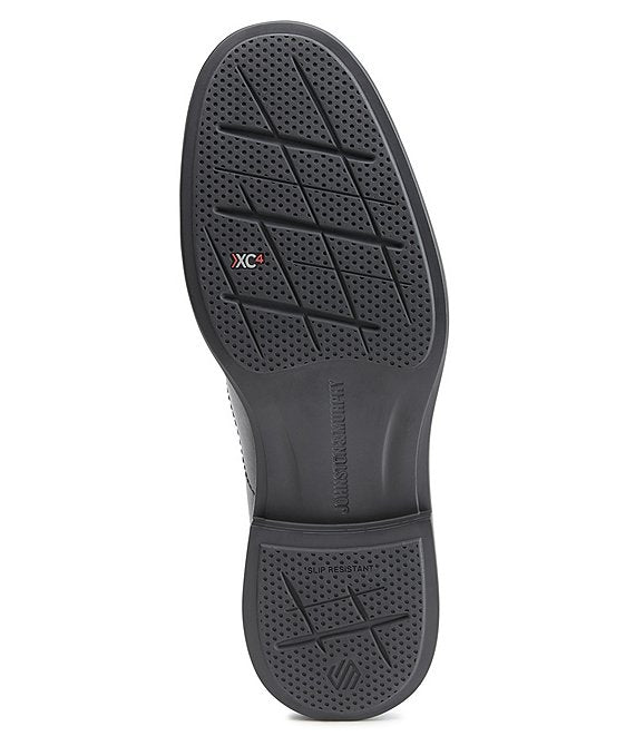 Johnston & Murphy XC4 Stanton 2.0 Waterproof Moc Toe shoe outsole with slip-resistant tread and XC4 branding in black, bottom view.