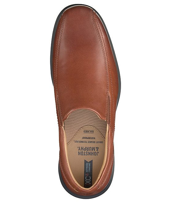 Johnston & Murphy XC4 Stanton 2.0 Waterproof Run-Off Slip-On shoe in brown leather with contrast stitching, top view.