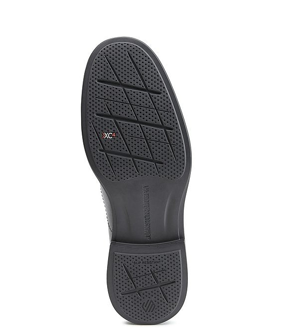 Johnston & Murphy XC4 Stanton 2.0 Waterproof Run-Off Slip-On black outsole with slip-resistant tread and XC4 branding, sole/bottom view.
