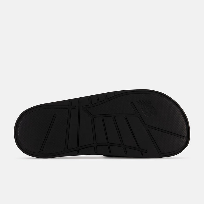 New Balance Zare Comfort shoe sole in black showing textured tread pattern and durable rubber material, bottom view.