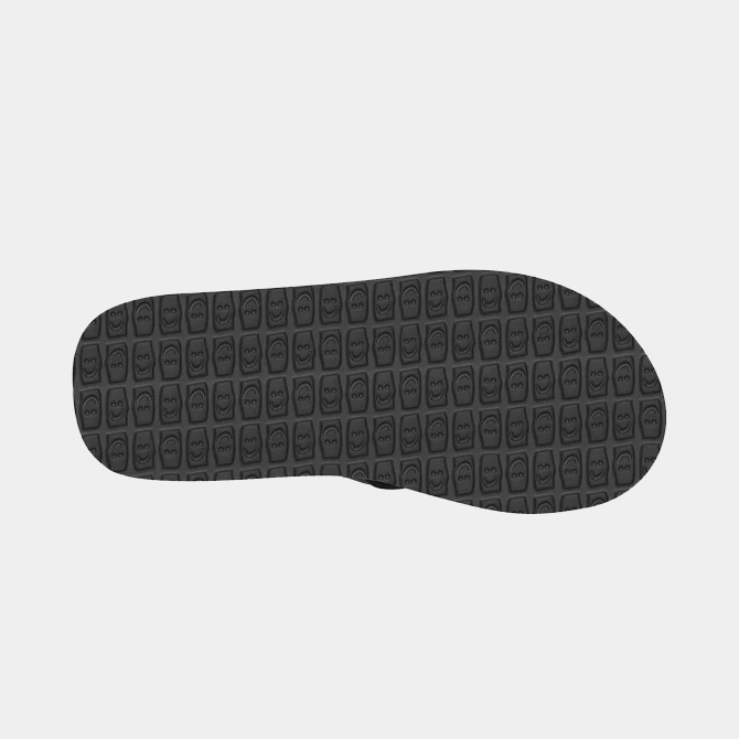 Sanuk Ziggy sandal outsole in black rubber with textured pattern featuring smiley face details, sole/bottom view.