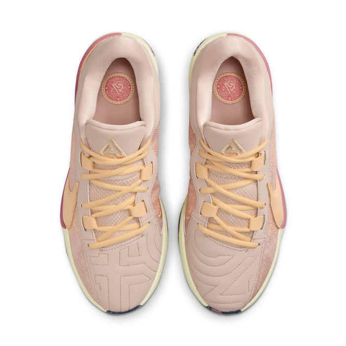 Nike Zoom Freak 5 basketball shoes in light pink with peach accents, mesh upper, abstract patterns, and lace system, top view.