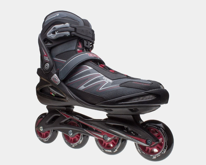 Roces ZYX inline skates in black with red and gray accents, featuring a secure buckle and strap system, side view.